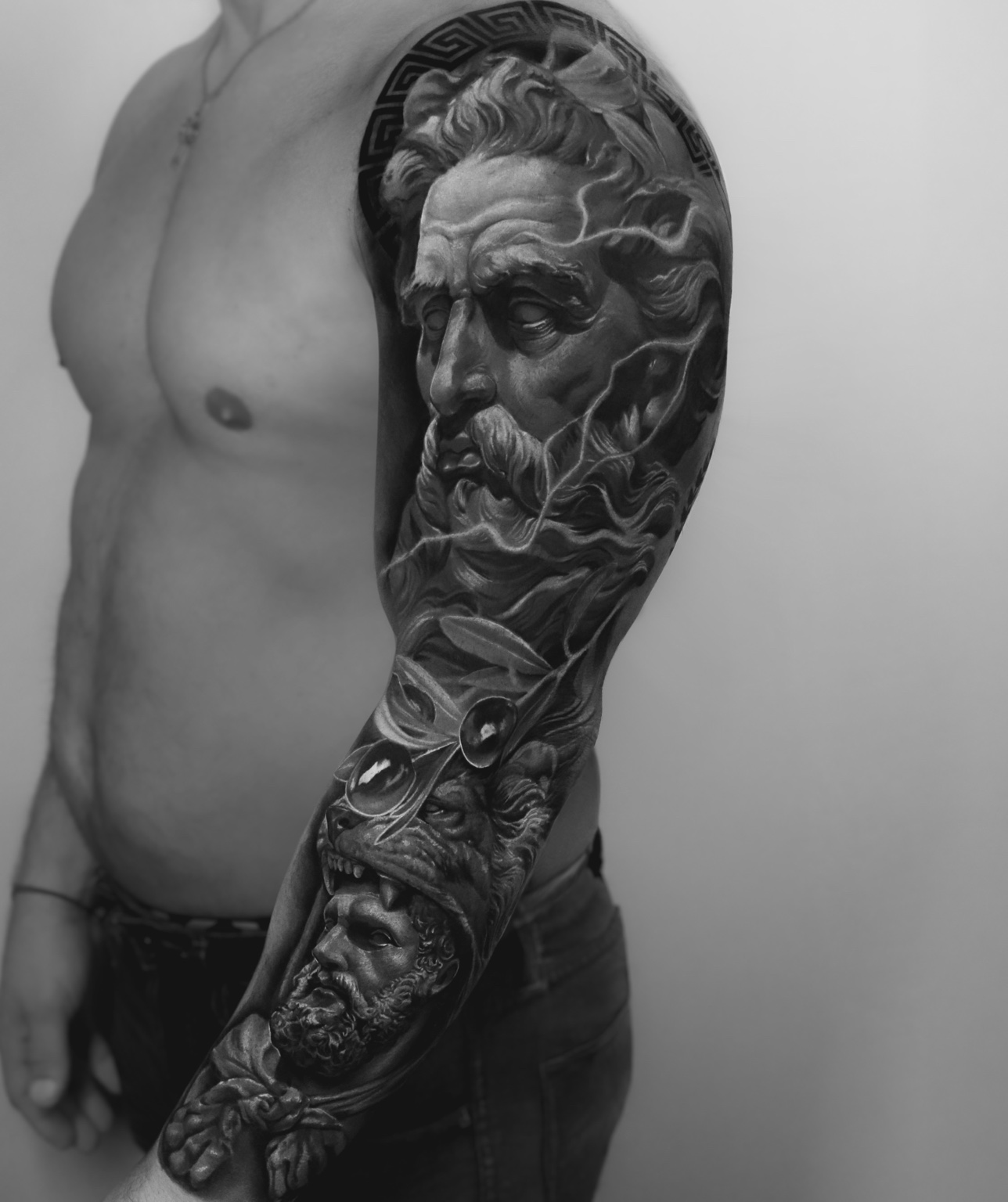 Black-and-grey mythological sleeve tattoo by Tony Vilella
