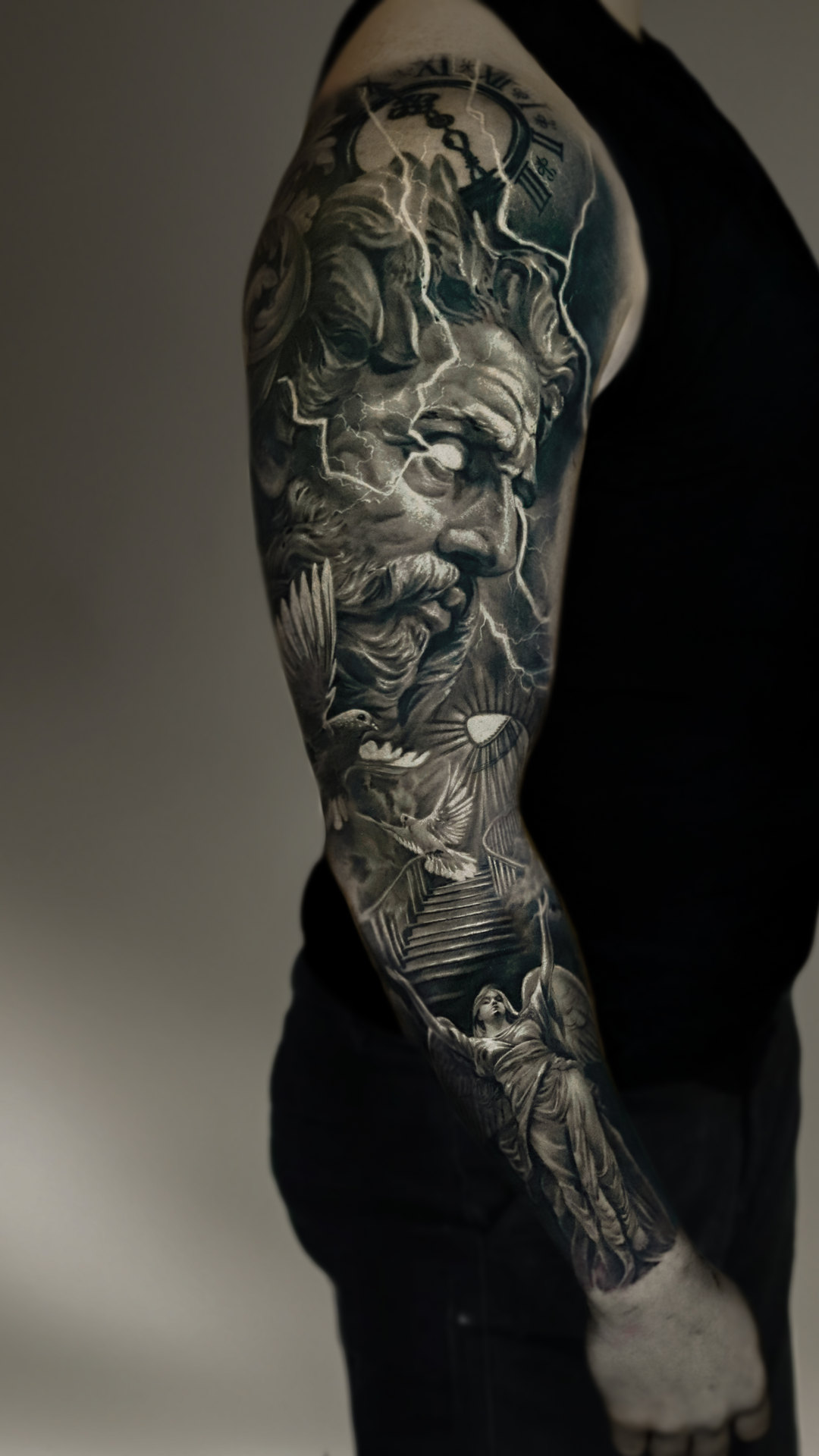 Black-and-gray realism arm sleeve by Tony Vilella