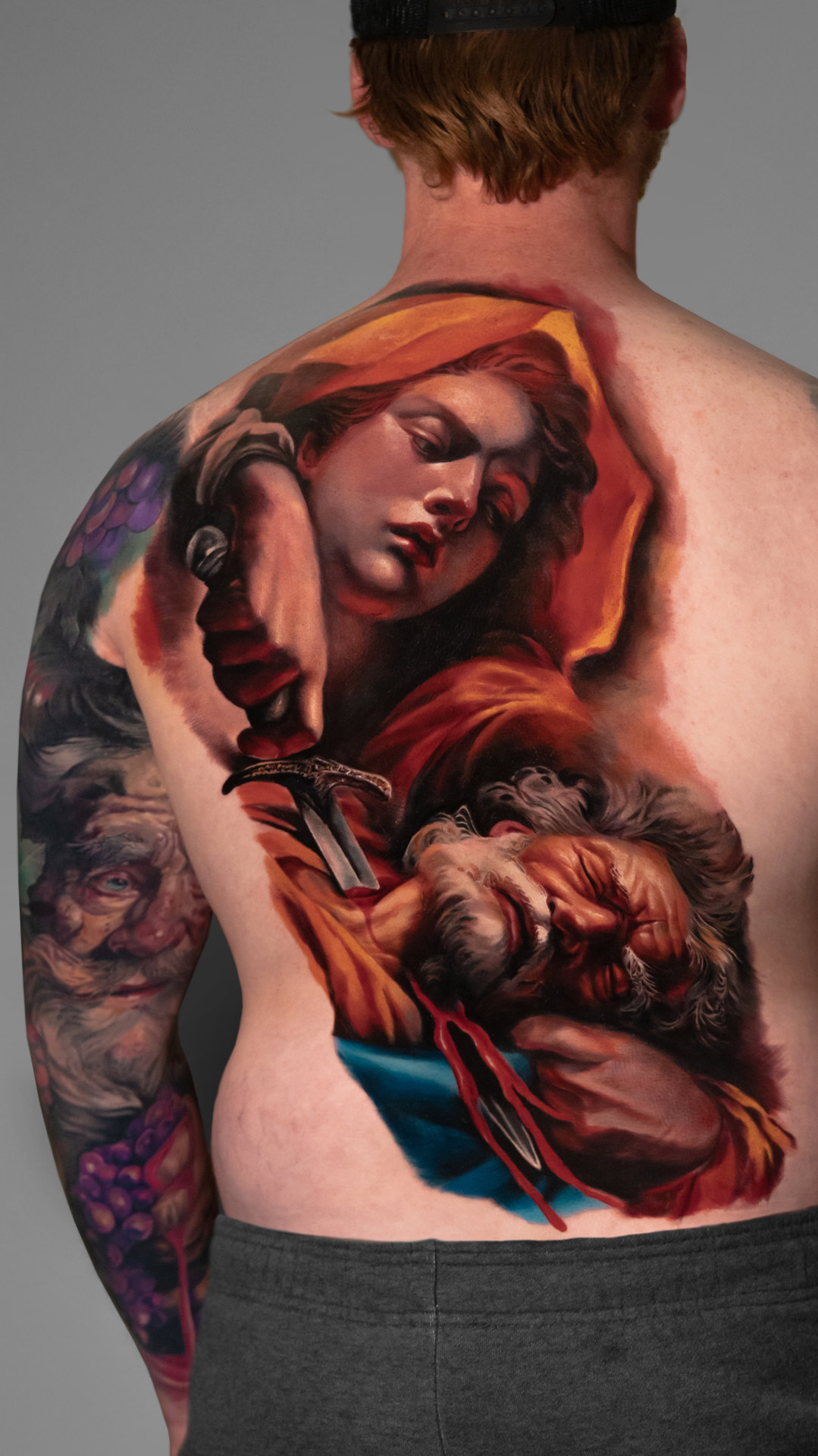 Fine-art inspired color realism arm tattoo by Tony Vilella