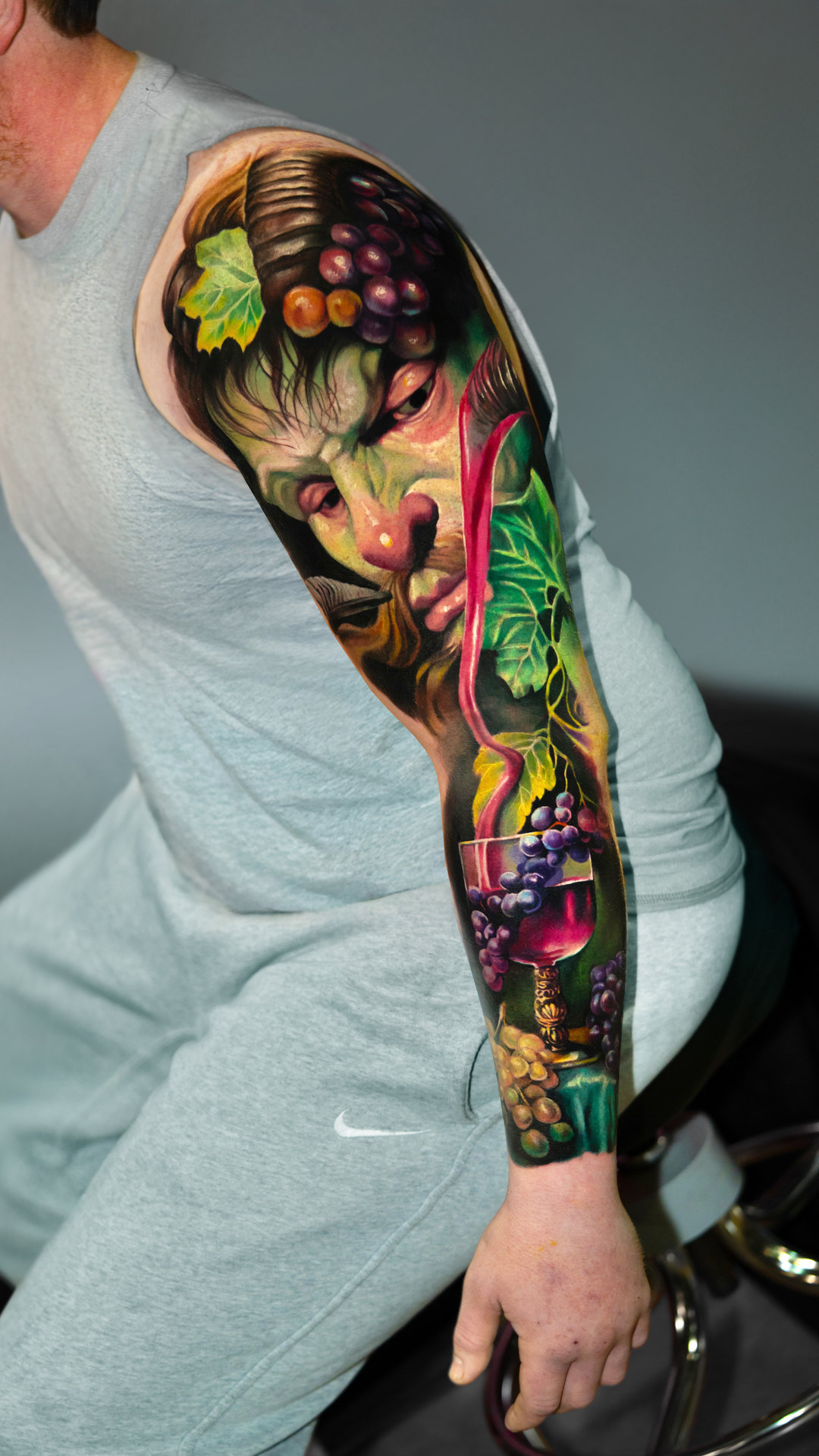 Surreal color portrait upper-arm tattoo by Tony Vilella
