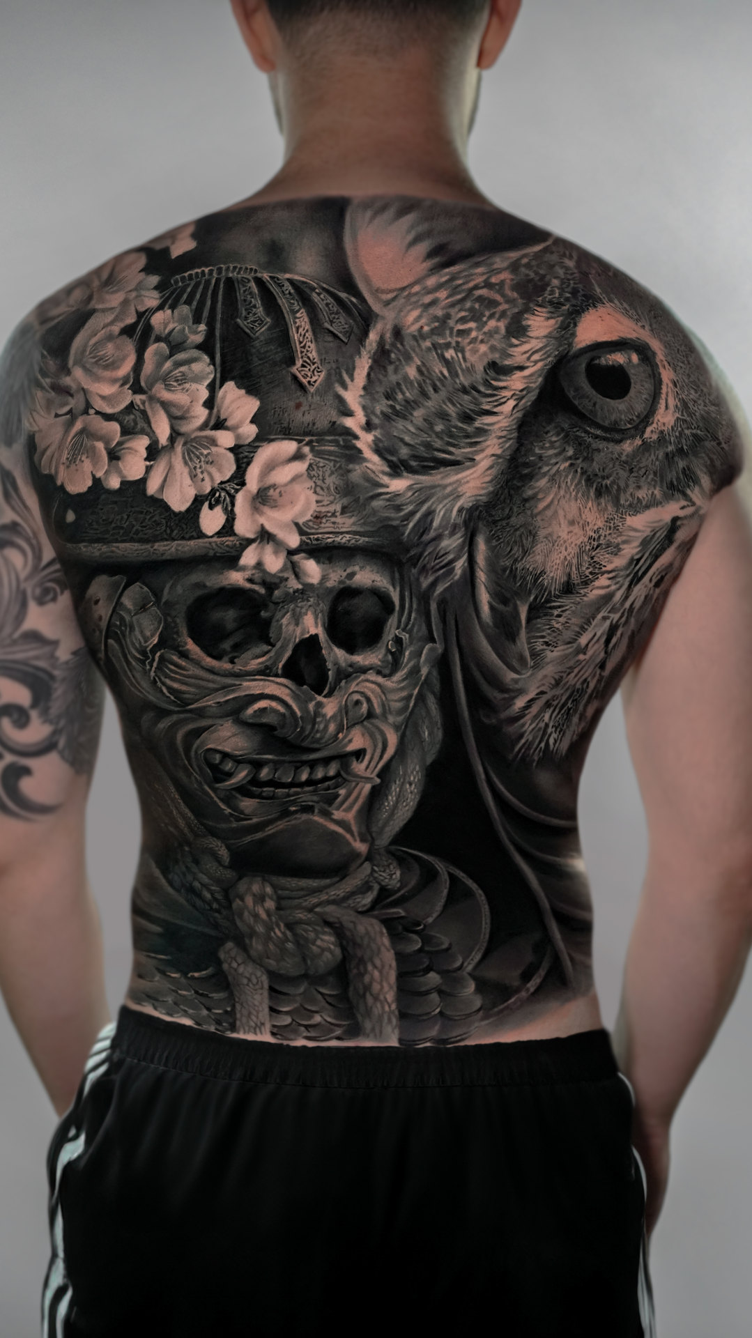Large black-and-gray samurai full-back tattoo by Tony Vilella