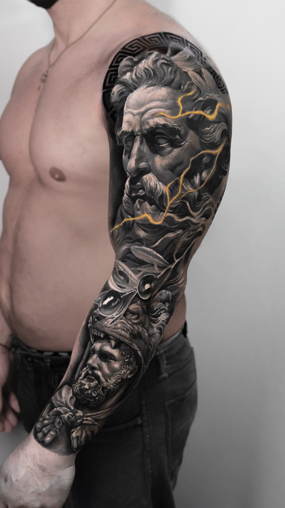 Black-and-gray realism sleeve featuring Zeus and Hercules by Tony Vilella